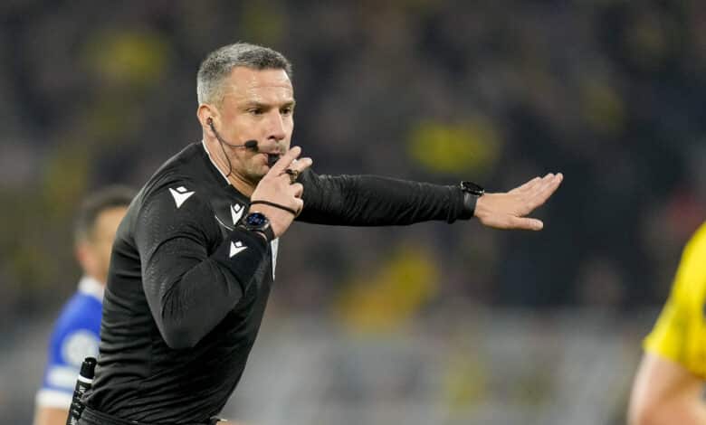 DORTMUND, GERMANY - APRIL 16: referee Slavko Vincic gestures during the UEFA Champions League quarter-final second leg match between Borussia Dortmund and Atletico Madrid at Signal Iduna Park on April 16, 2024 in Dortmund, Germany.