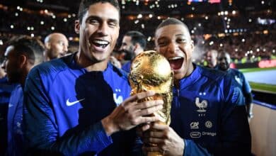 Football Lore - Kylian Mbappe and Raphael Varane celebrate France's World Cup win