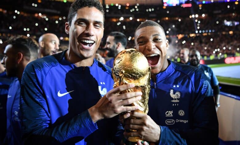 Football Lore - Kylian Mbappe and Raphael Varane celebrate France's World Cup win