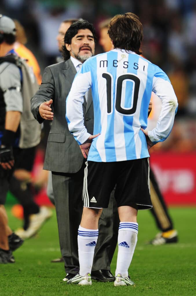 Diego Maradona head coach of Argentina consoles Lionel Messi of Argentina after the 2010 FIFA World Cup South Africa