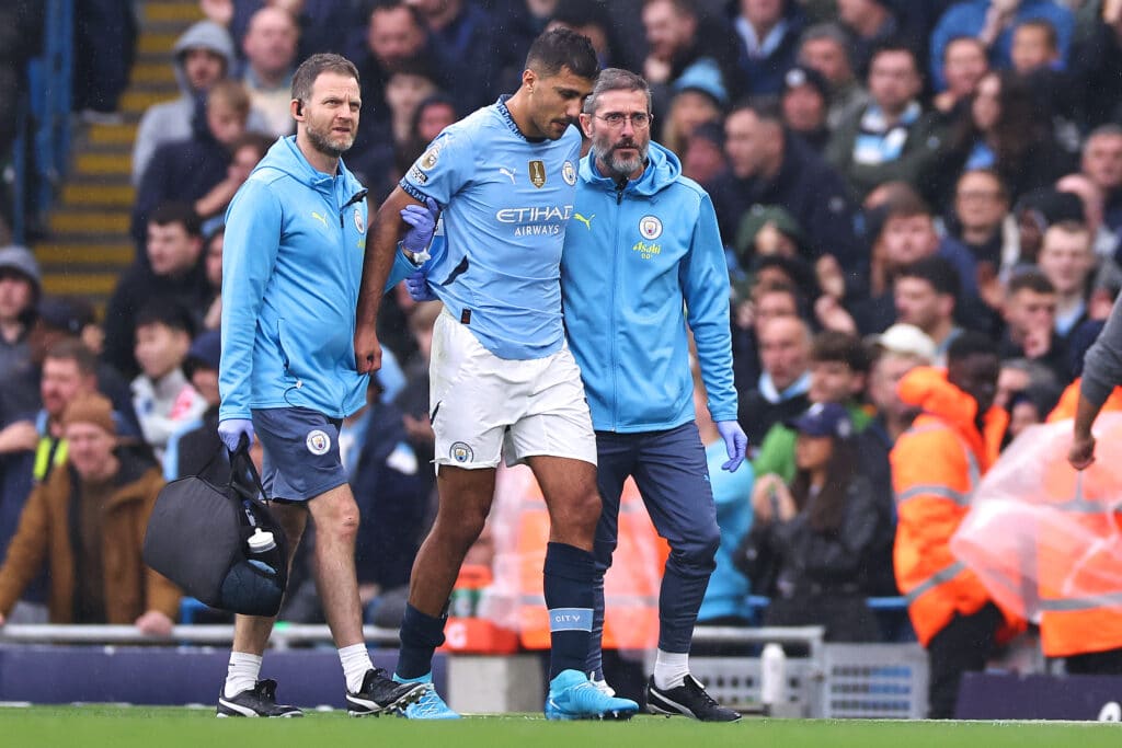 MANCHESTER, ENGLAND - SEPTEMBER 22: Rodri of Manchester City goes off injured during the Premier League match between Manchester City FC and Arsenal FC at Etihad Stadium on September 22, 2024 in Manchester, England.
