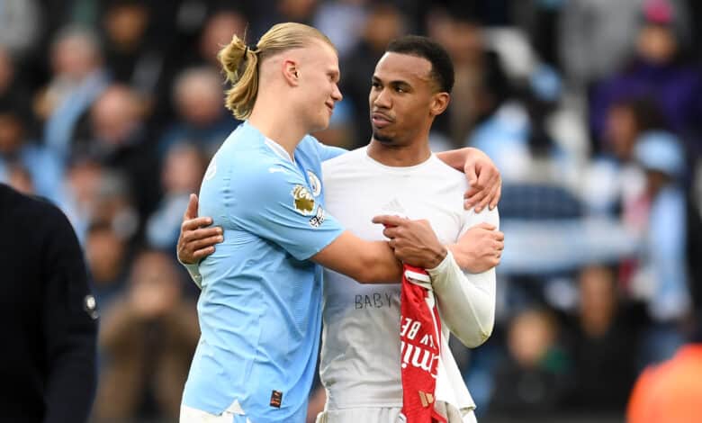 Erling Haaland of Manchester City interacts with Gabriel of Arsenal following the Premier League match between Manchester City and Arsenal FC at Etihad Stadium on March 31, 2024 in Manchester, England.