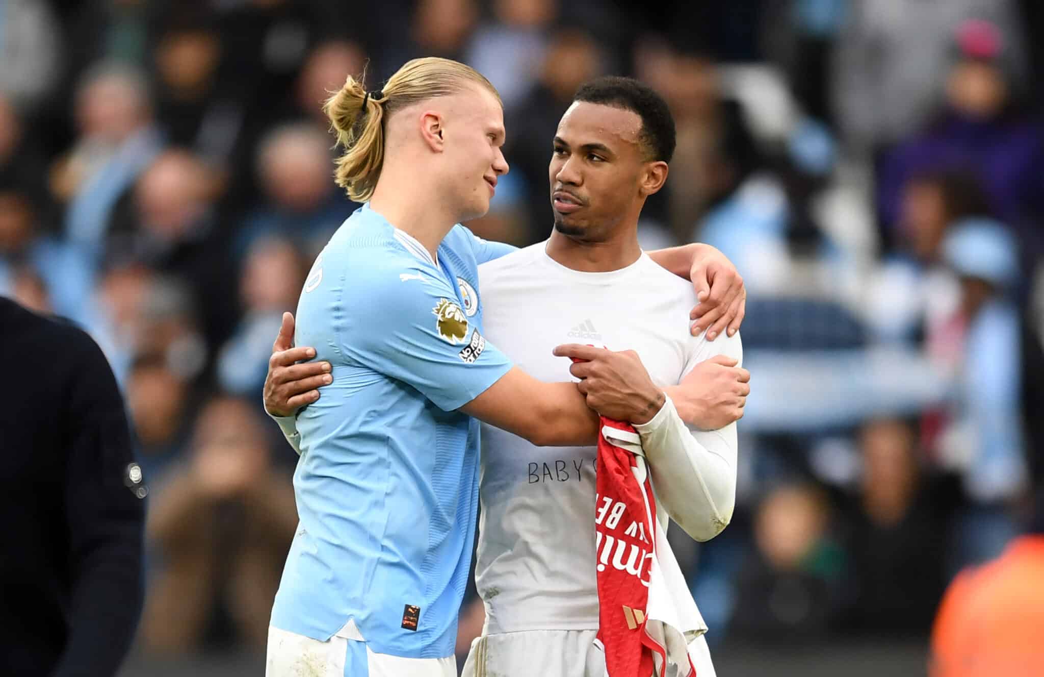 Erling Haaland of Manchester City interacts with Gabriel of Arsenal following the Premier League match between Manchester City and Arsenal FC at Etihad Stadium on March 31, 2024 in Manchester, England.