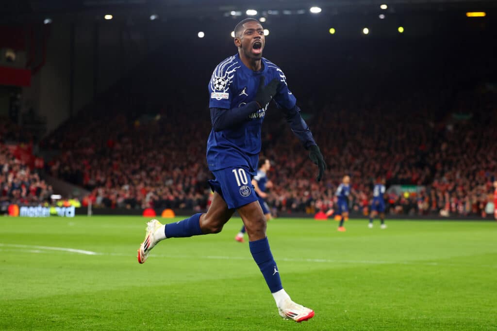 LIVERPOOL, ENGLAND - MARCH 11: Ousmane Dembele of Paris Saint-Germain celebrates scoring the opening goal during the UEFA Champions League 2024/25 UEFA Champions League 2024/25 Round of 16 Second Leg match between Liverpool FC and Paris Saint-Germain at Anfield on March 11, 2025 in Liverpool, England.