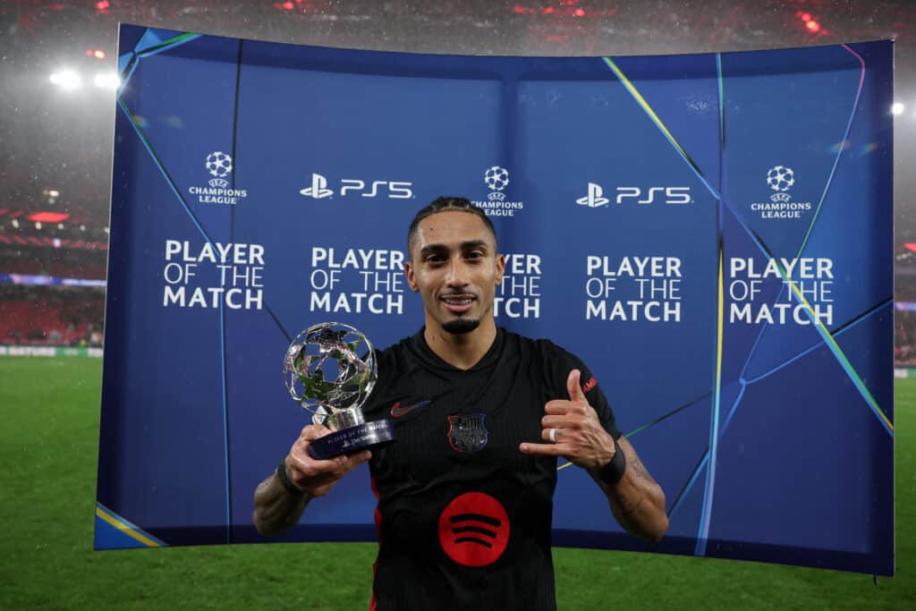 LISBON, PORTUGAL - JANUARY 21: Raphinha of Barcelona poses with the Player of The match award during the UEFA Champions League 2024/25 League Phase MD7 match between SL Benfica and FC Barcelona at on January 21, 2025 in Lisbon, Portugal.