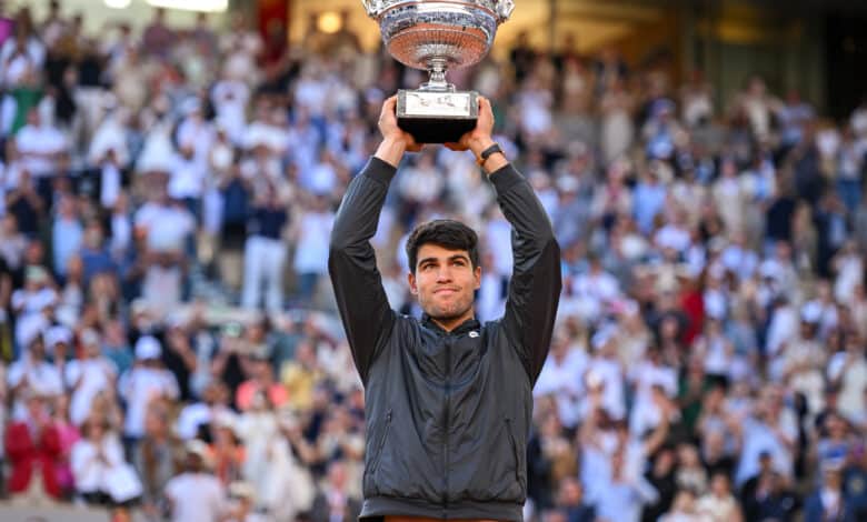 Carlos Alcaraz of Spain celebrates with the winners trophy after victory against Alexander Zverev