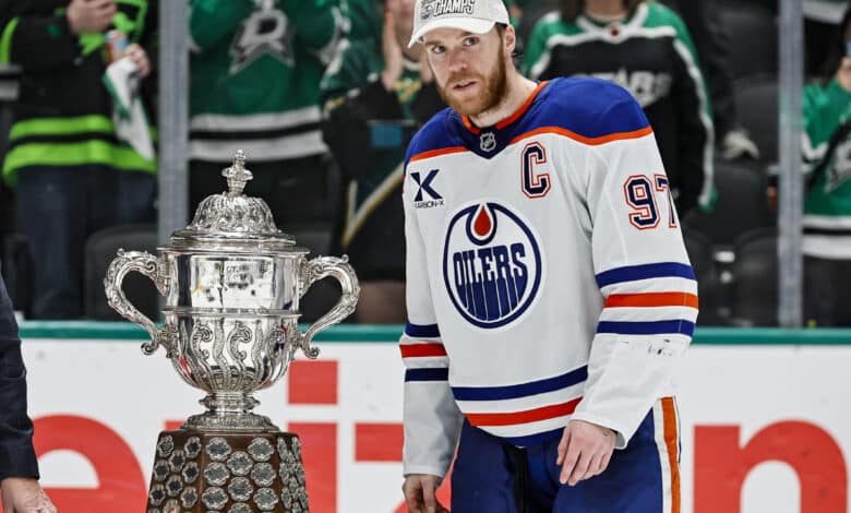 DALLAS, TX - MAY 29: Edmonton Oilers center Connor McDavid (97) accepts the Clarence S. Campbell Trophy after game 5 of the Western Conference Final between the Dallas Stars and the Edmonton Oilers on May 29, 2025 at American Airlines Center in Dallas, Texas.