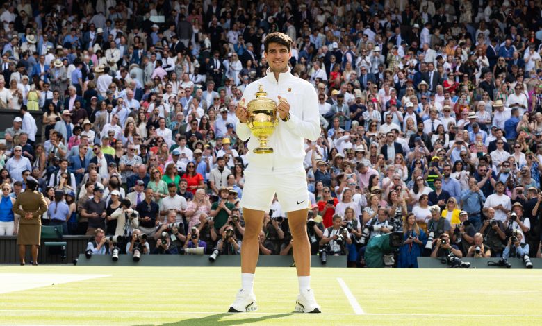 LONDON, ENGLAND - JULY 14: Carlos Alcaraz of Spain holds the trophy after defeating Novak Djokovic of Serbia at the Mens Singles Final against at The Wimbledon Lawn Tennis Championship at the All England Lawn and Tennis Club at Wimbledon on July 14th, 2024 in London, England.