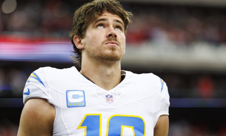 HOUSTON, TEXAS - JANUARY 11: Quarterback Justin Herbert #10 of the Los Angeles Chargers stands on the sidelines during the national anthem prior to an AFC Wild Card game against the Houston Texans, at NRG Stadium on January 11, 2025 in Houston, Texas. (