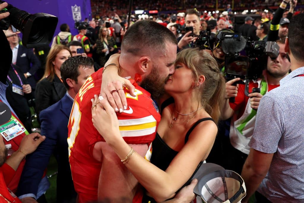LAS VEGAS, NEVADA - FEBRUARY 11: Travis Kelce #87 of the Kansas City Chiefs and Taylor Swift embrace after defeating the San Francisco 49ers in overtime during Super Bowl LVIII at Allegiant Stadium on February 11, 2024 in Las Vegas, Nevada.