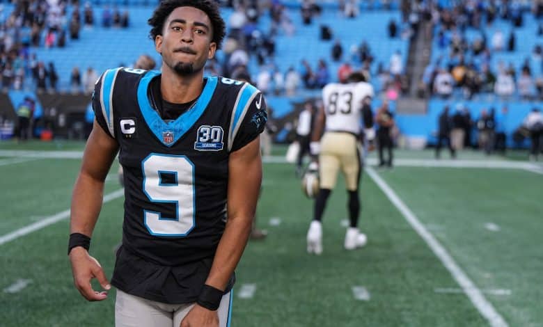 Bryce Young #9 of the Carolina Panthers runs off the field after winning his game against the New Orleans Saints