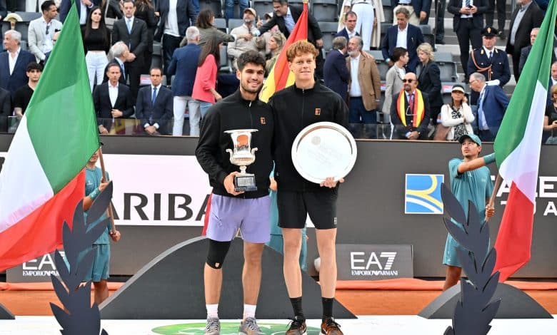 ROME, ITALY - MAY 18: Carlos Alcaraz of Spain poses with the trophy as he celebrates victory alongside runner up Jannik Sinner of Italy following the Men's Singles Final match on Day Fourteen of the Internazionali BNL D'Italia 2025 at Foro Italico on May 18, 2025 in Rome, Italy.