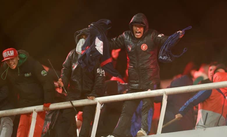 A fan of Independiente shouts during the interruption of the Copa Sudamericana round of 16 second leg football match between Argentina's Independiente and Chile's Universidad de Chile at the Libertadores de America stadium in Avellaneda, Buenos Aires province, Argentina on August 20, 2025.