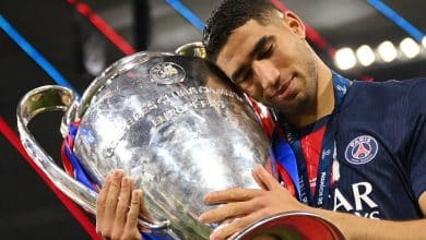 MUNICH, GERMANY - MAY 31: Achraf Hakimi of Paris Saint-Germain celebrates with the UEFA Champions League trophy after his team's victory, to secure Paris Saint-Germain's first ever UEFA Champions League title in the club's history and a record UEFA Champions League Final winning scoreline of 5-0, following the UEFA Champions League Final 2025 between Paris Saint-Germain and FC Internazionale Milano at Munich Football Arena on May 31, 2025 in Munich, Germany.
