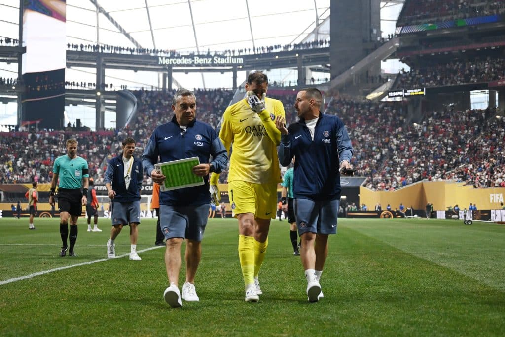 ATLANTA, GEORGIA - JULY 05: Gianluigi Donnarumma #1 of Paris Saint-Germain looks dejected as he speaks with backroom staff as he leaves the pitch at half-time during the FIFA Club World Cup 2025 quarter-final match between Paris Saint-Germain and FC Bayern München at Mercedes-Benz Stadium on July 05, 2025 in Atlanta, Georgia. 