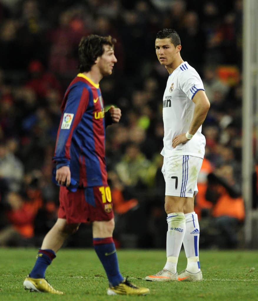 Real Madrid's Portuguese forward Cristiano Ronaldo (R) looks at Barcelona's Argentinian forward Lionel Messi during the Spanish league "clasico" football match FC Barcelona vs Real Madrid at Camp Nou stadium on November 29, 2010 in Barcelona. Barcelona won 5-0. AFP PHOTO/ JAVIER SORIANO