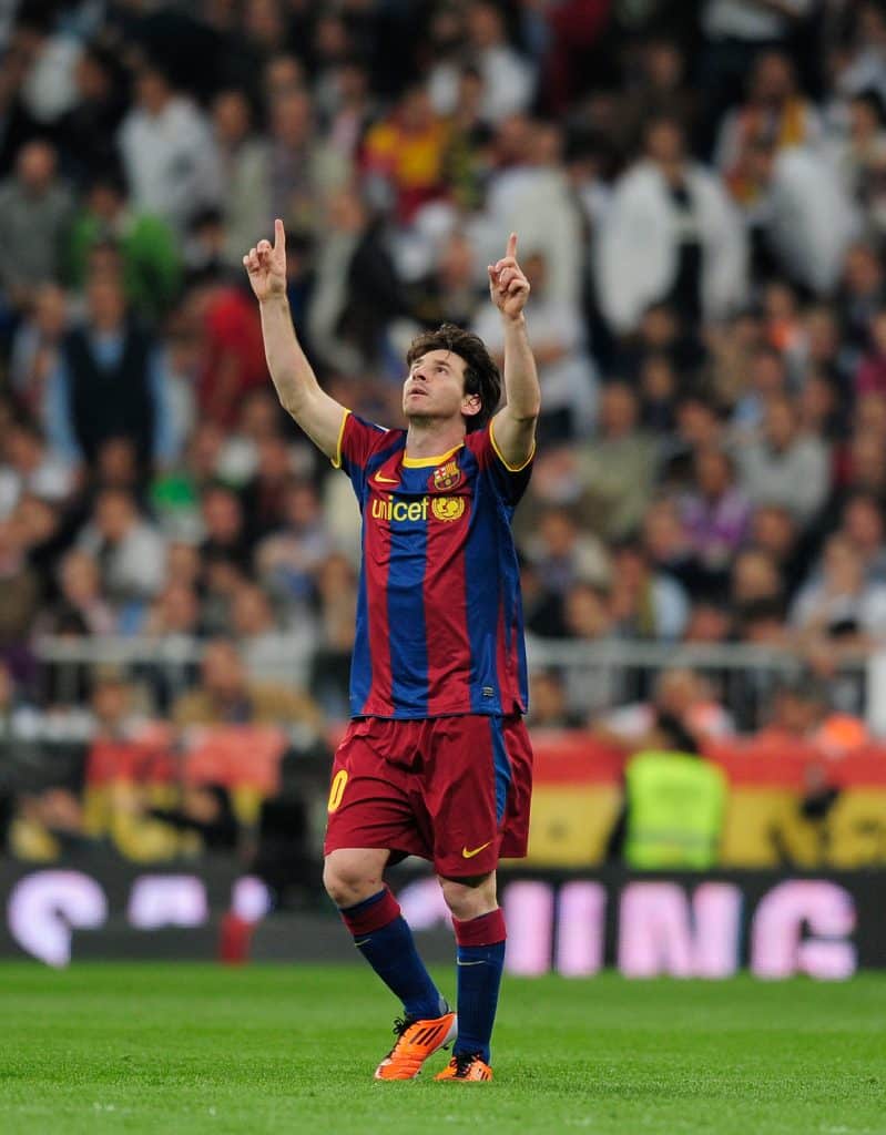 Barcelona's Argentinian forward Lionel Messi celebrates after scoring during 'El Clasico' Spanish League football match Real Madrid against Barcelona at the Santiago Bernabeu stadium in Madrid on April 16, 2011