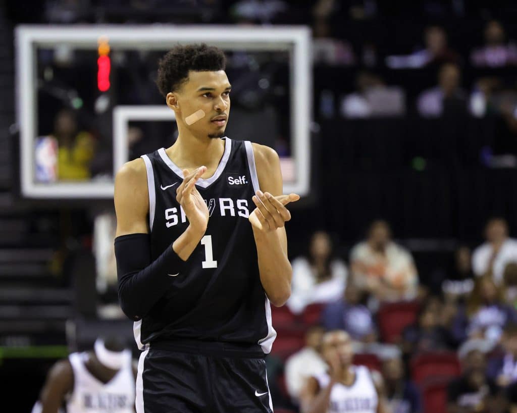 LAS VEGAS, NEVADA - JULY 09: Victor Wembanyama #1 of the San Antonio Spurs claps his hands as he walks on the court during a break in the second half of a 2023 NBA Summer League game against the Portland Trail Blazers at the Thomas & Mack Center on July 09, 2023 in Las Vegas, Nevada. NOTE TO USER: User expressly acknowledges and agrees that, by downloading and or using this photograph, User is consenting to the terms and conditions of the Getty Images License Agreement.