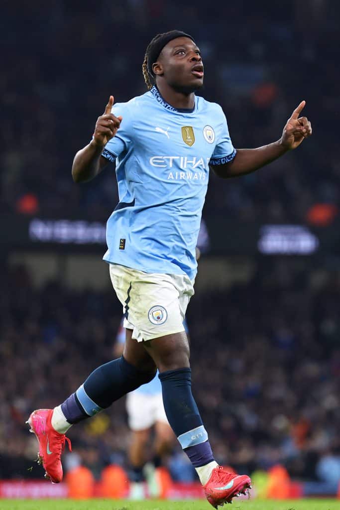 MANCHESTER, ENGLAND - JANUARY 11: Jeremy Doku of Manchester City celebrates after scoring a goal to make it 6-0 during the Emirates FA Cup Third Round match between Manchester City and Salford City at Etihad Stadium on January 11, 2025 in Manchester, England. 