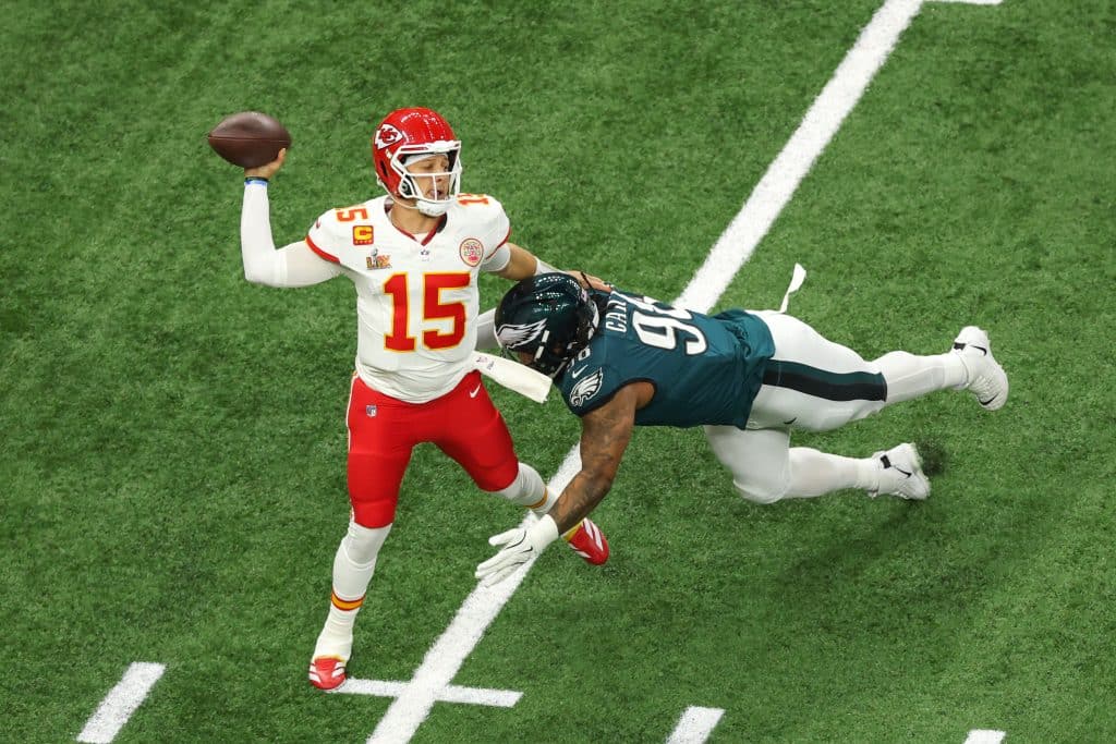 NEW ORLEANS, LA - FEBRUARY 09: QB Patrick Mahomes #15 of the Kansas City Chiefs readies for a pass as DT Jalen Carter #98 of the Philadelphia Eagles readies for a sack during Super Bowl LIX between the Kansas City Chiefs and the Philadelphia Eagles on Sunday February 9, 2025 at the Caesars Superdome in New Orleans, LA.