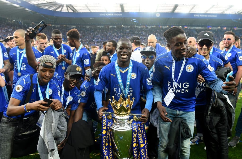 LEICESTER, ENGLAND - MAY 07:  Ngolo Kante of Leicester City poses with the Premier League Trophy with his family as players and staffs celebrate the season champion after the Barclays Premier League match between Leicester City and Everton at The King Power Stadium on May 7, 2016 in Leicester, United Kingdom.