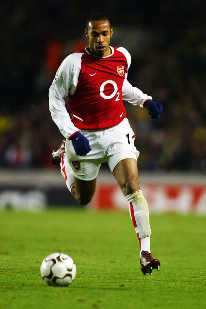 LONDON - DECEMBER 10: Thierry Henry of Arsenal running with the ball during the UEFA Champions League Group B match between Arsenal and Lokomotiv Moscow on December 10, 2003 at Highbury in London, England. Arsenal won the match 2-0.