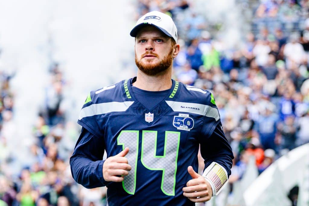 SEATTLE, WASHINGTON - AUGUST 7: Sam Darnold #14 of the Seattle Seahawks looks on before the NFL Preseason 2025 game against the Las Vegas Raiders at Lumen Field on August 7, 2025 in Seattle, Washington.