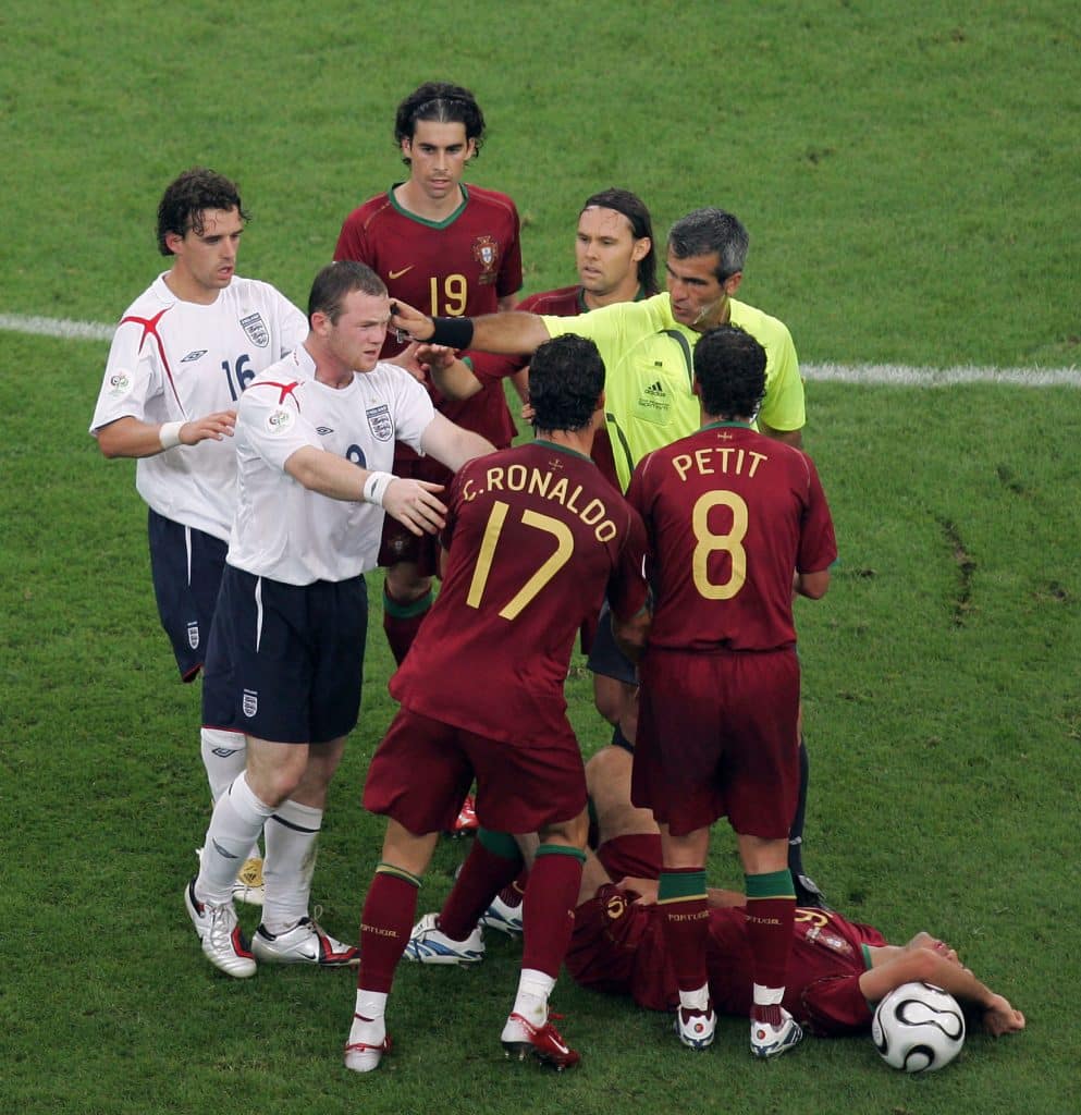 01/07/2006 World Cup Football Quarter Final. England v Portugal."nWayne Rooney pushes Cristiano Ronaldo in view of the referee Horacio Elizondo after his tussle with Ricardo Carvalho