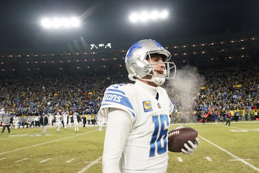 GREEN BAY, WISCONSIN - JANUARY 08: Jared Goff #16 of the Detroit Lions celebrates after defeating the Green Bay Packers at Lambeau Field on January 08, 2023 in Green Bay, Wisconsin.