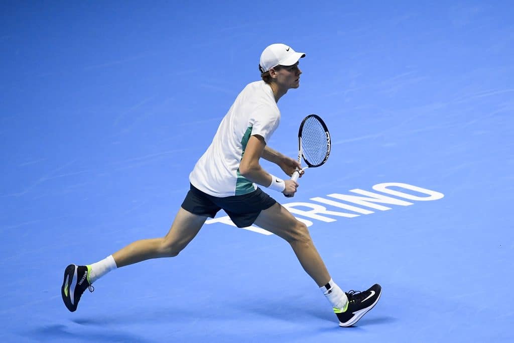 TURIN, ITALY - NOVEMBER 18: Jannik Sinner of Italy plays a shot against Daniil Medvedev in their Semi Finals Men's Single's Nitto ATP match  during day seven of the Nitto ATP Finals at Pala Alpitour on November 18, 2023 in Turin, Italy.