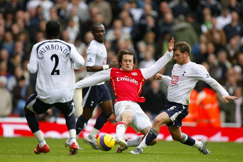 LONDON, ENGLAND - December 2: Teemu Tainio of Tottenham Hotspur and Tomas Rosicky of Arsenal challenge during the Premier League match between Arsenal and Tottenham Hotspur at Emirates Stadium on December 2, 2006 in London, England. 