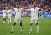 TOPSHOT - England's midfielder #10 Jude Bellingham celebrates with England's forward #09 Harry Kane after scoring his team's first goal during the UEFA Euro 2024 round of 16 football match between England and Slovakia at the Arena AufSchalke in Gelsenkirchen on June 30, 2024