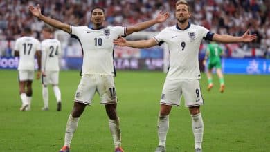 TOPSHOT - England's midfielder #10 Jude Bellingham celebrates with England's forward #09 Harry Kane after scoring his team's first goal during the UEFA Euro 2024 round of 16 football match between England and Slovakia at the Arena AufSchalke in Gelsenkirchen on June 30, 2024