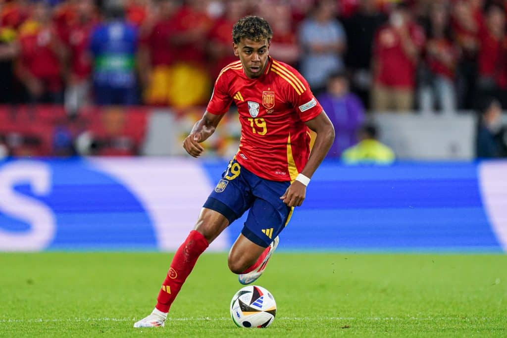 COLOGNE, GERMANY - JUNE 30: Lamine Yamal of Spain dribbles during the Round of 16 - UEFA EURO 2024 match between Spain and Georgia at Cologne Stadium on June 30, 2024 in Cologne, Germany