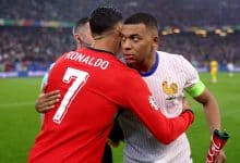 Kylian Mbappe of France embraces Cristiano Ronaldo of Portugal