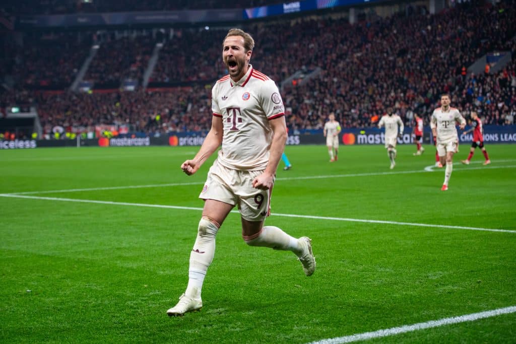 Harry Kane of Bayern Munich celebrates after scoring his team's first goal during the UEFA Champions League 2024/25 Round of 16 second leg match between Bayer 04 Leverkusen and FC Bayern Munich at BayArena on March 11, 2025 in Leverkusen, Germany.
