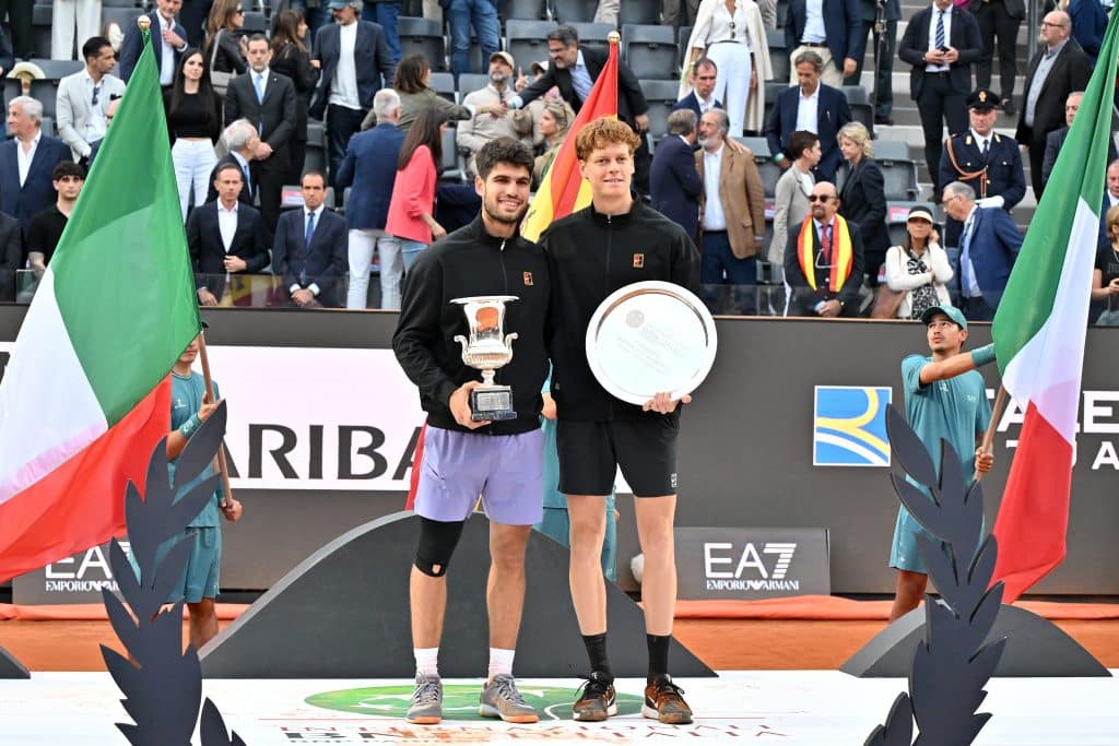 ROME, ITALY - MAY 18: Carlos Alcaraz of Spain poses with the trophy as he celebrates victory alongside runner up Jannik Sinner of Italy following the Men's Singles Final match on Day Fourteen of the Internazionali BNL D'Italia 2025 at Foro Italico on May 18, 2025 in Rome, Italy. 