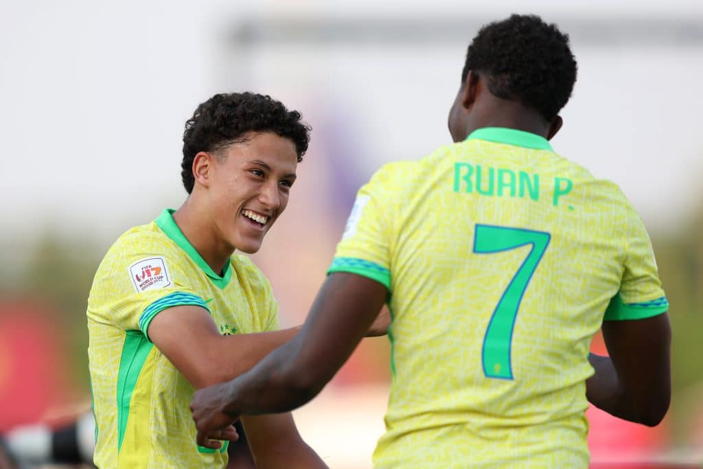 DOHA, QATAR - NOVEMBER 04: Felipe Morais of Brazil celebrates scoring his team's third goal with teammates Ruan Pablo during the FIFA Under-17 World Cup match between Brazil and Honduras at Aspire Academy on November 04, 2025 in Doha, Qatar.