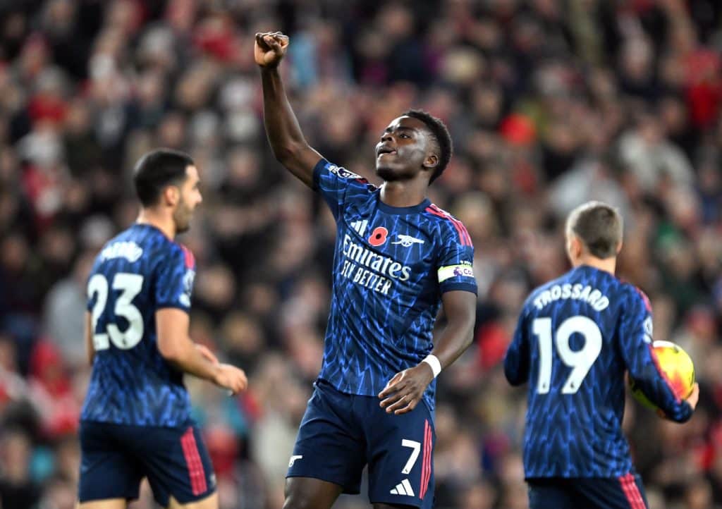 Bukayo Saka of Arsenal celebrates scoring his team's first goal during the Premier League