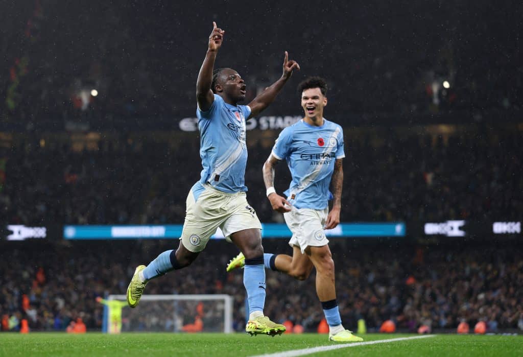 Jeremy Doku of Manchester City celebrates scoring his team's third goal during the Premier League