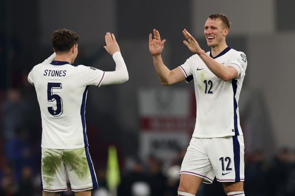 TIRANA, ALBANIA - NOVEMBER 16: John Stones and Dan Burn of England celebrate victory during the FIFA World Cup 2026 qualifier match between Albania and England at Air Albania Stadium on November 16, 2025 in Tirana, Albania.