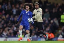 Marc Cucurella of Chelsea battles for the ball with Lamine Yamal of Barcelona