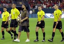 Rapper/Singer Drake brings out the game ball with the officials at NRG Stadium