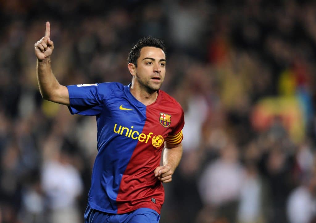Barcelona's midfielder Xavi Hernandez celebrates after scoring during a Spanish League football match against Malaga on March 22, 2009 at the Camp Nou stadium in Barcelona. AFP PHOTO/LLUIS GENE