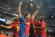 MADRID, SPAIN - MAY 02: Xavi Hernandez of Barcelona celebrates after Gerard Pique scored Barcelona's sixth goal during the La Liga match between Real Madrid and Barcelona at the Santiago Bernabeu stadium on May 2, 2009 in Madrid, Spain.