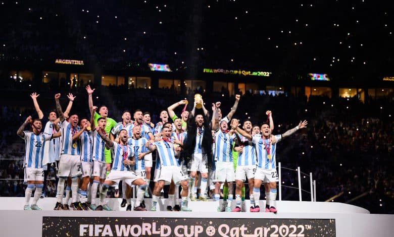 Lionel Messi of Argentina (C) celebrate with their FIFA World Cup Qatar 2022 trophy