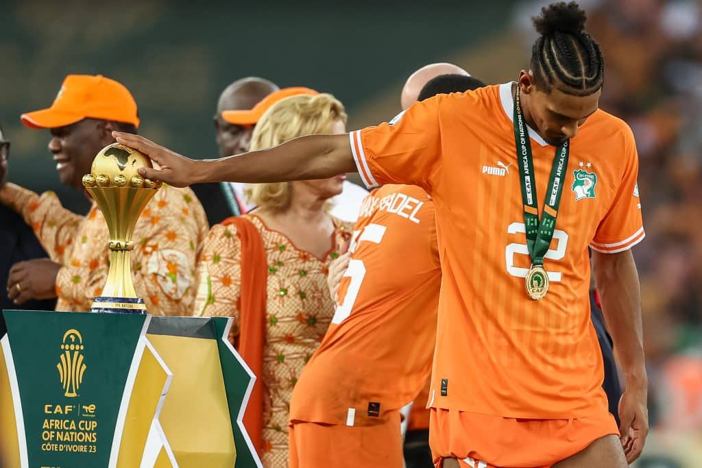 Ivory Coast's forward #22 Sebastien Haller touches the Africa Cup of Nations trophy