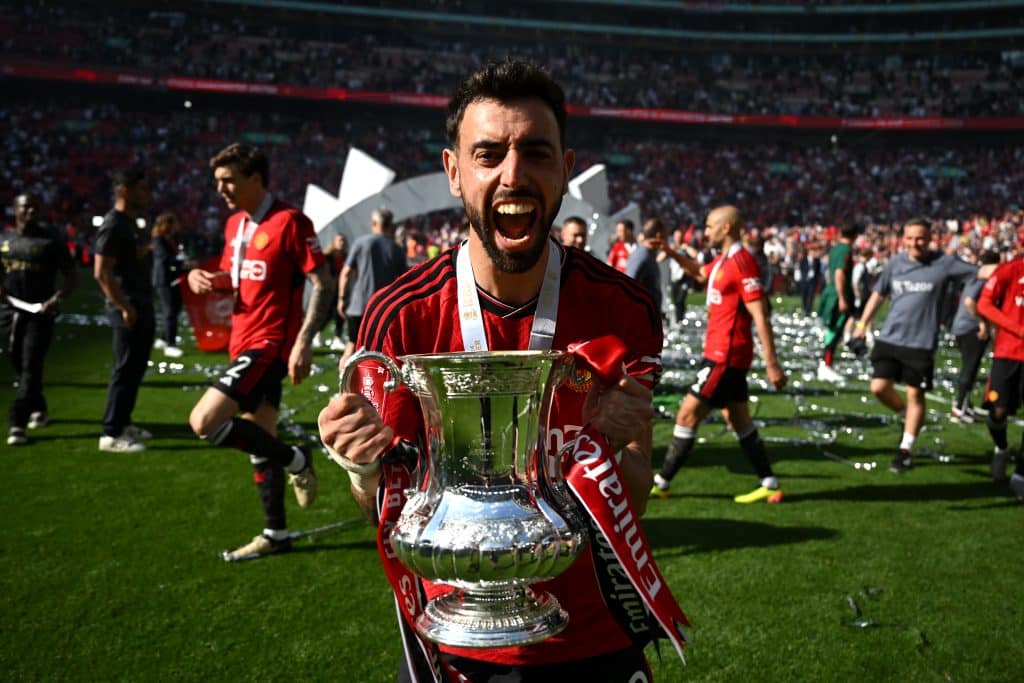 LONDON, ENGLAND - MAY 25: Bruno Fernandes of Manchester United celebrates with the Emirates FA Cup Trophy after his team's victory after the Emirates FA Cup Final match between Manchester City and Manchester United at Wembley Stadium on May 25, 2024 in London, England.