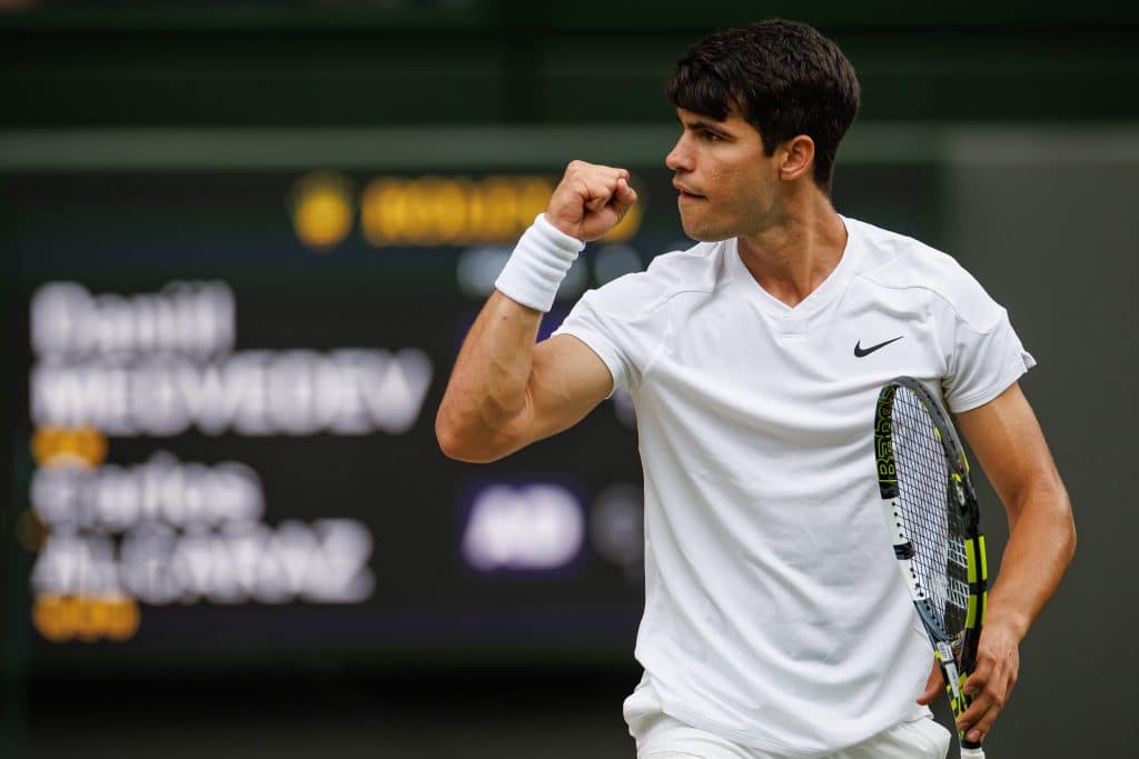 Carlos Alcaraz of Spain celebrates during his match against Daniil Medvedev of Russia in the semi-final of the men's singles during day twelve of The Championships Wimbledon 2024 at All England Lawn Tennis and Croquet Club on July 12, 2024 in London, England. 