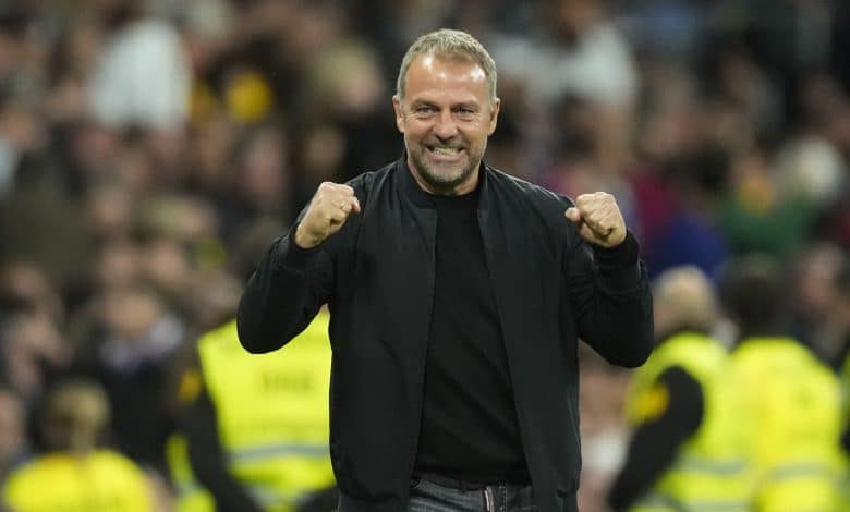 Hansi Flick head coach of Barcelona celebrates the goal of his team during the La Liga match between Real Madrid CF and FC Barcelona at Estadio Santiago Bernabeu on October 27, 2024 in Madrid, Spain.